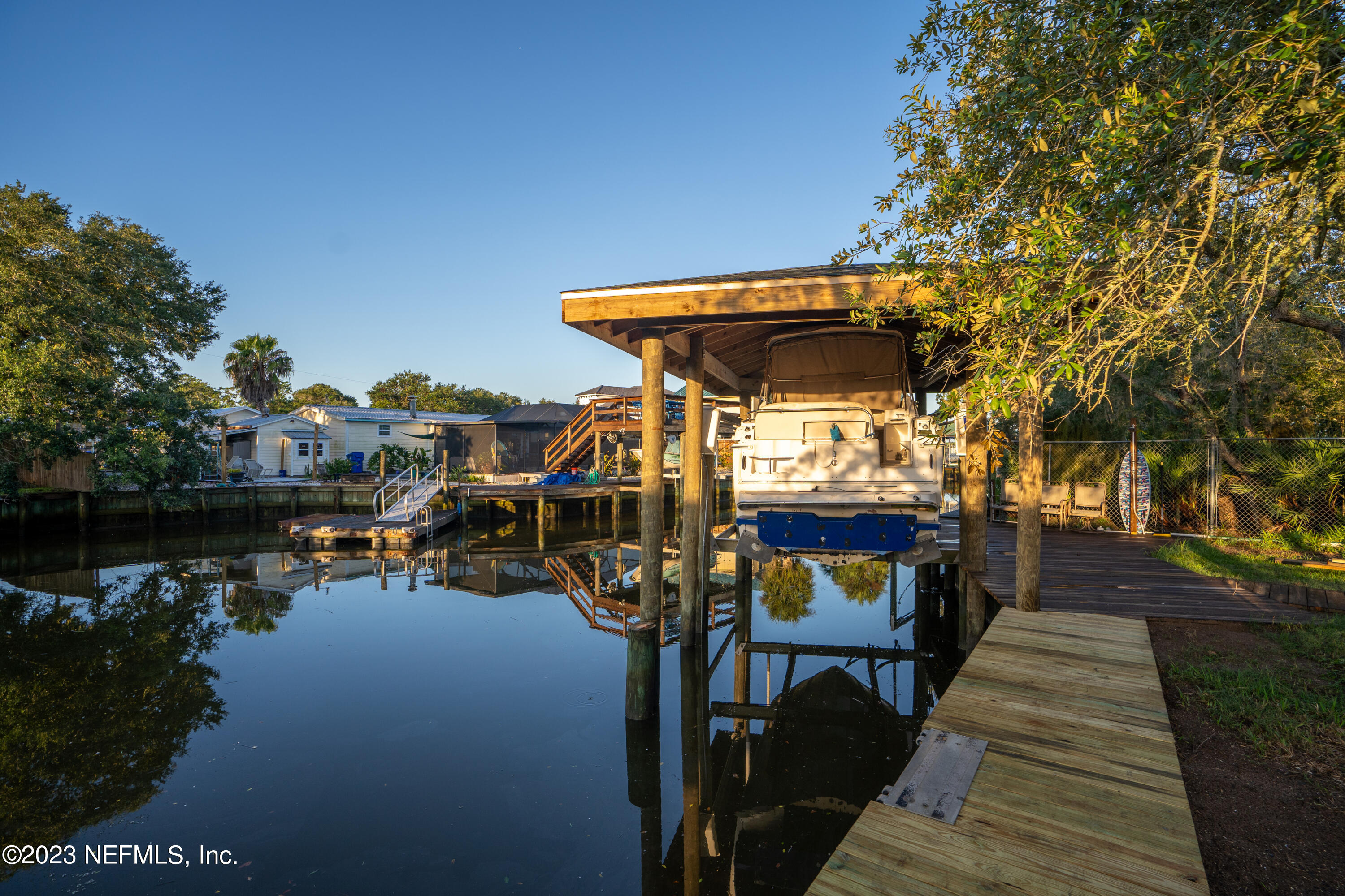 281 Ole Road St. Augustine, FL 32080 - Photo 23 of 61 a view of a patio with chairs under an umbrella