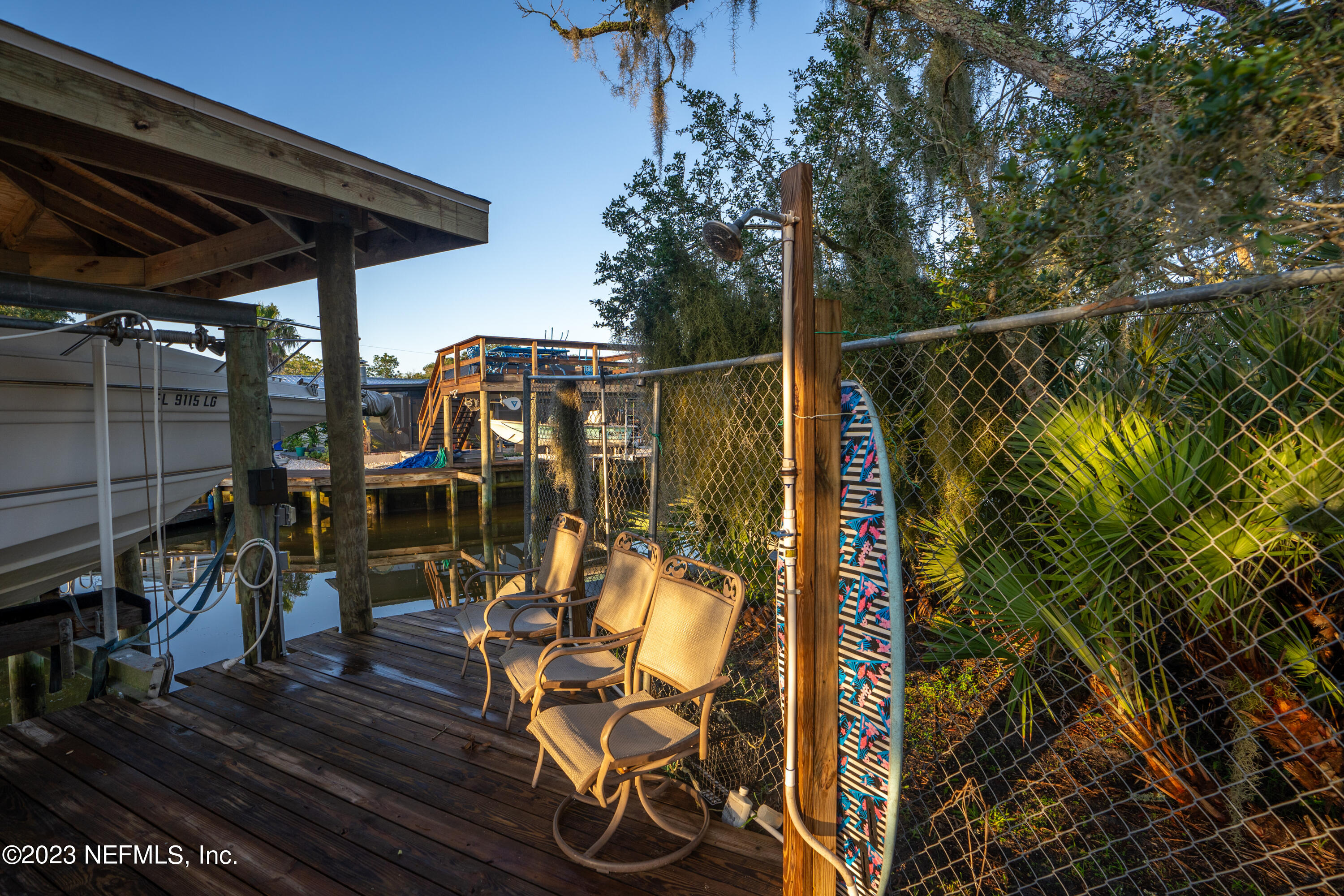 281 Ole Road St. Augustine, FL 32080 - Photo 25 of 61 a view of a wooden chairs and table in the patio