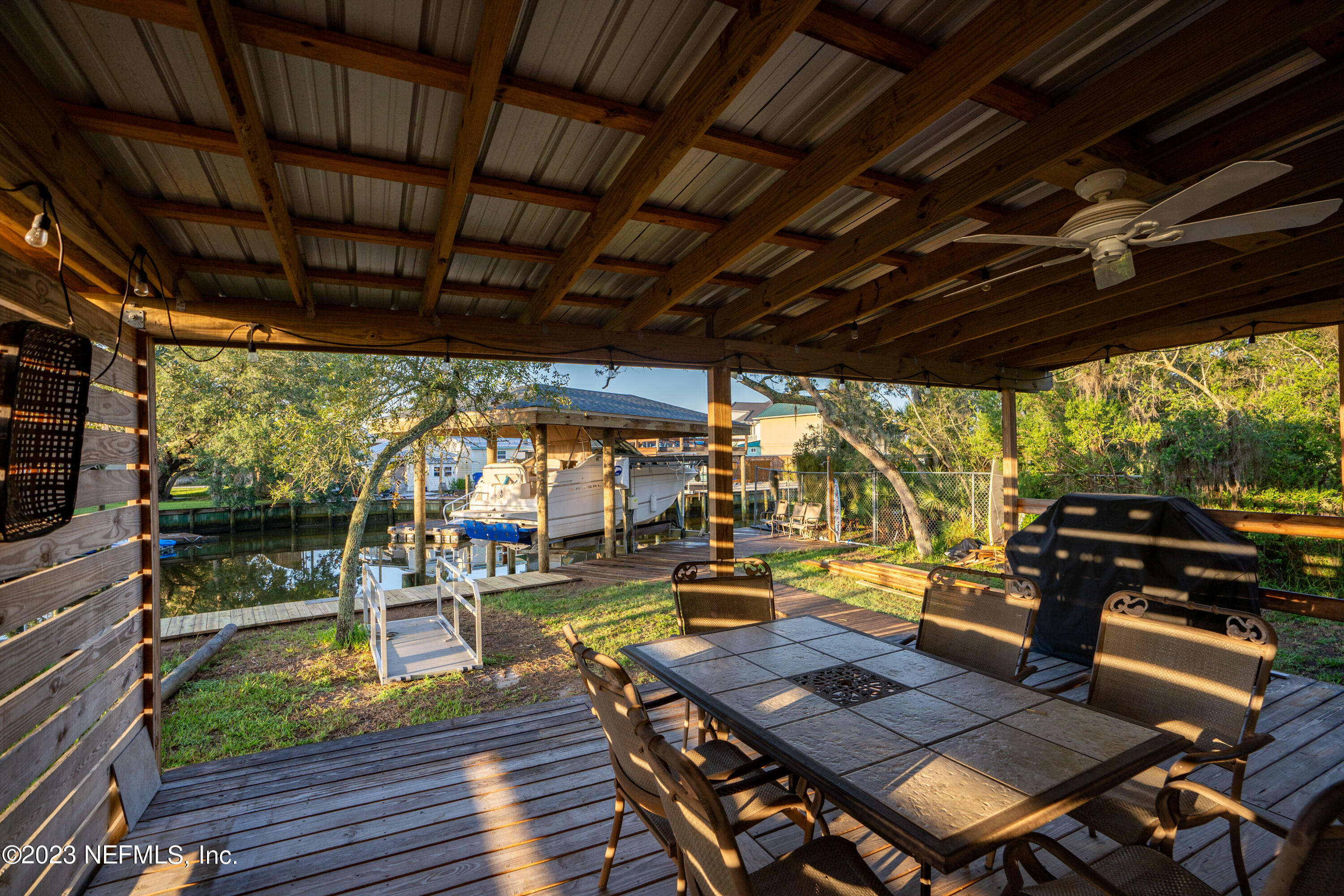 281 Ole Road St. Augustine, FL 32080 - Photo 30 of 61 a roof deck with a table and chairs