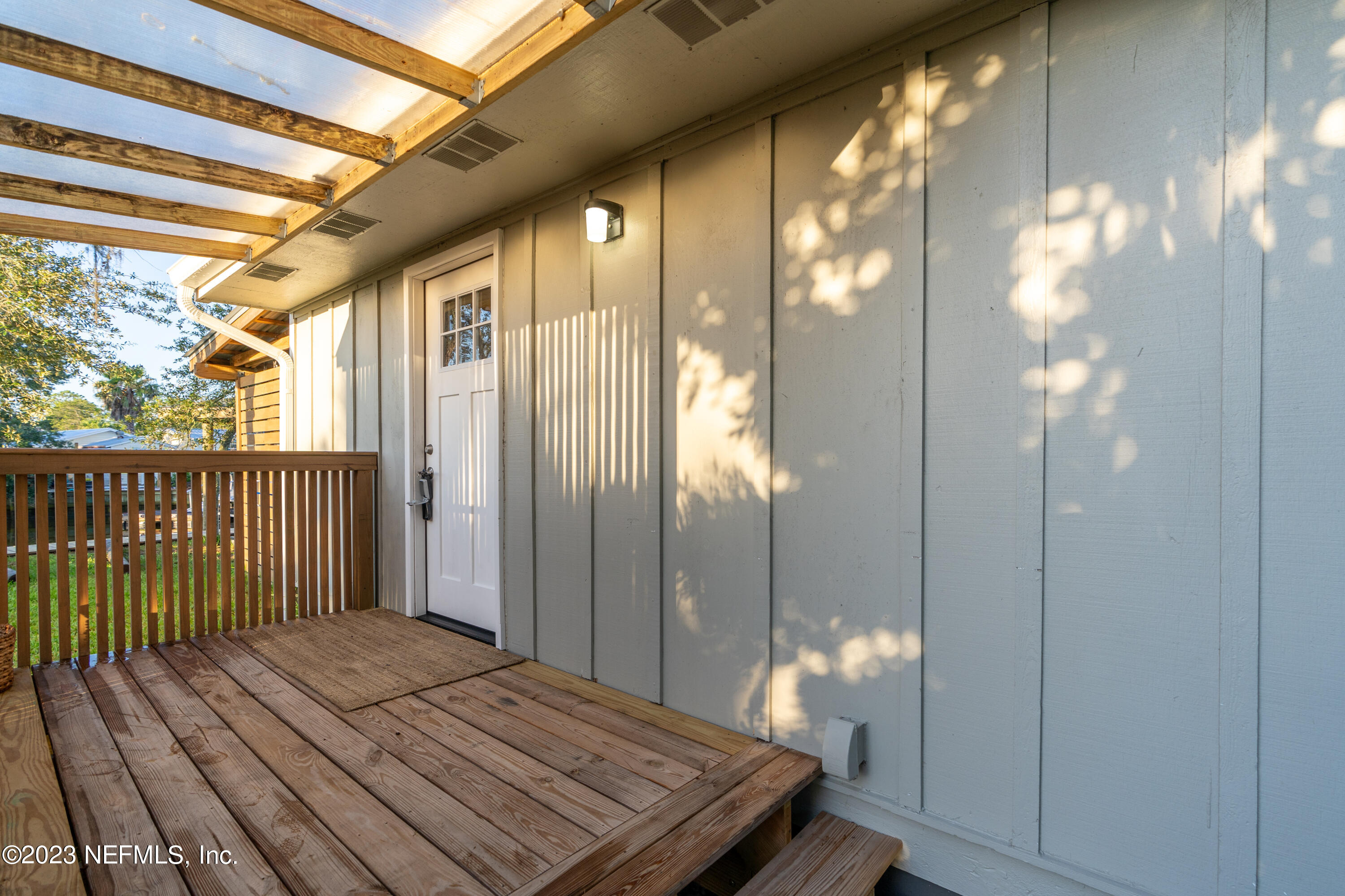 281 Ole Road St. Augustine, FL 32080 - Photo 33 of 61 a bedroom with a bed and a chandelier