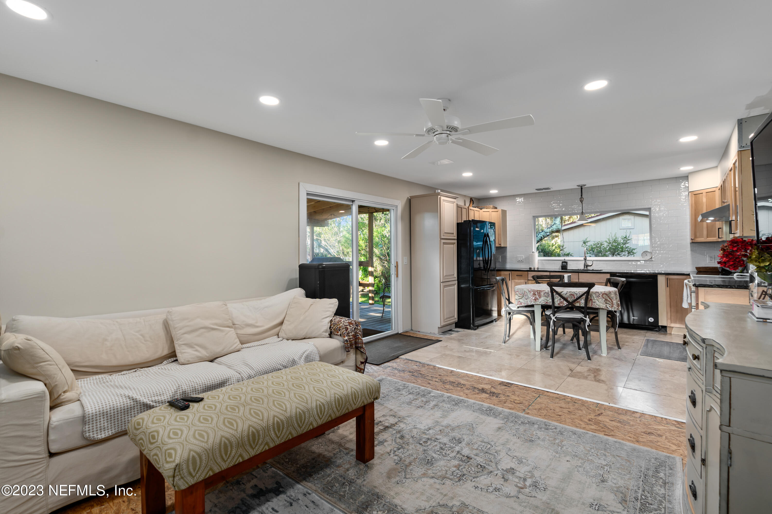 281 Ole Road St. Augustine, FL 32080 - Photo 34 of 61 a living room with furniture and a dining table with kitchen view