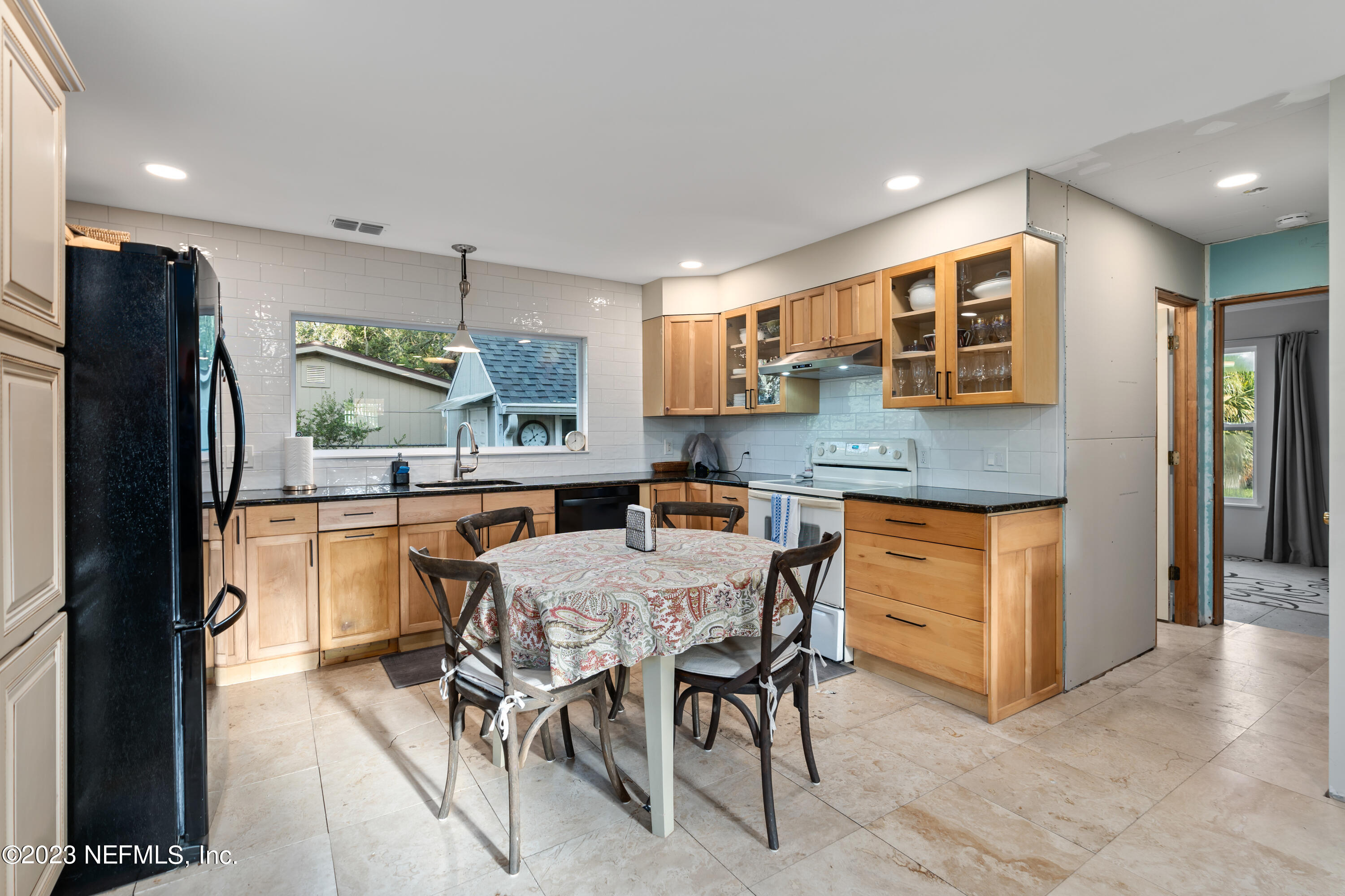 281 Ole Road St. Augustine, FL 32080 - Photo 40 of 61 a kitchen with stainless steel appliances granite countertop a refrigerator and a stove top oven