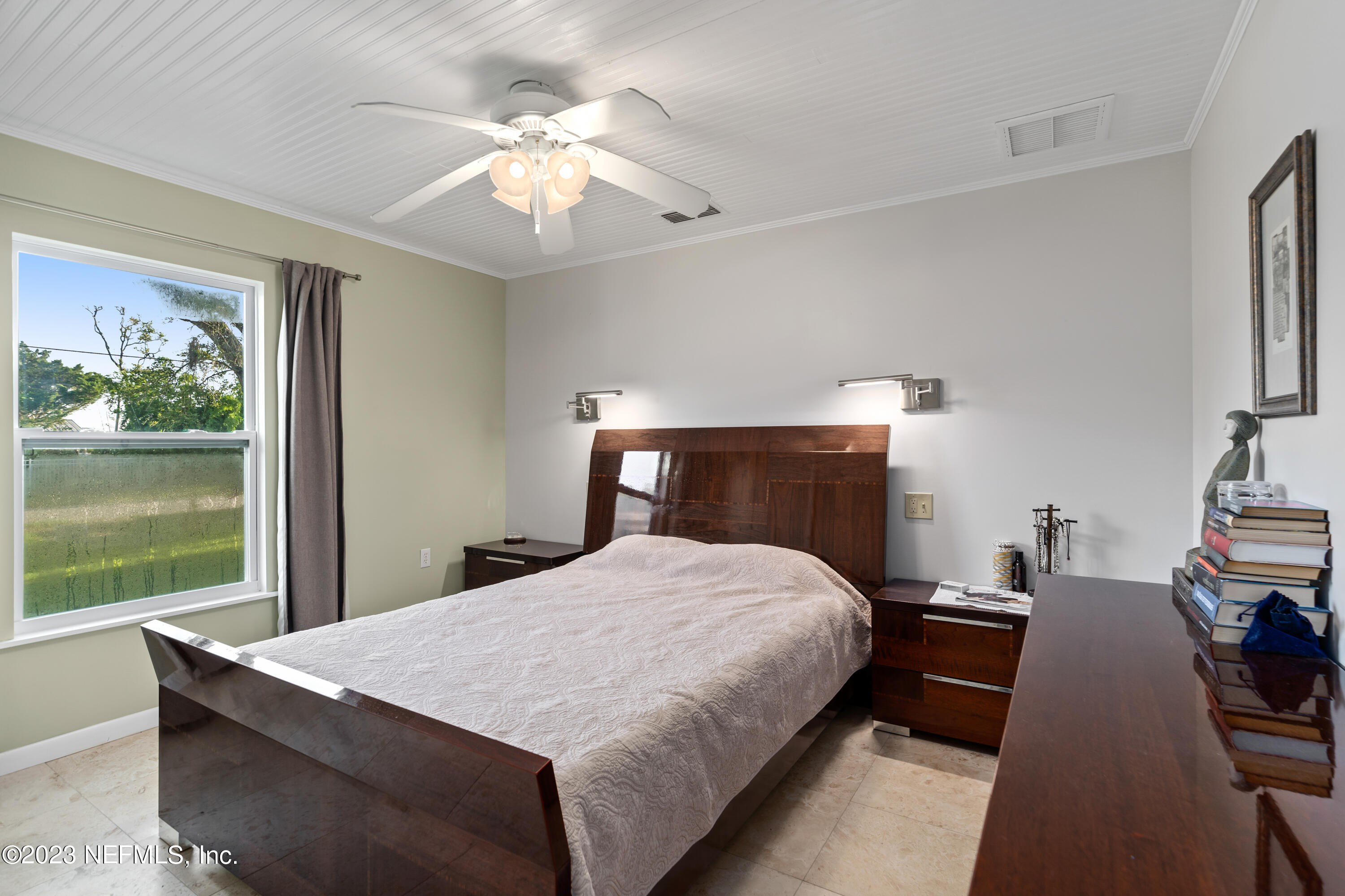 281 Ole Road St. Augustine, FL 32080 - Photo 45 of 61 a bed room with a bed and a chandelier