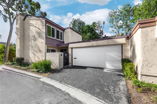a view of a front of house with a street