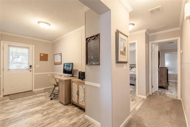 a view of a kitchen cabinets and a wooden floor