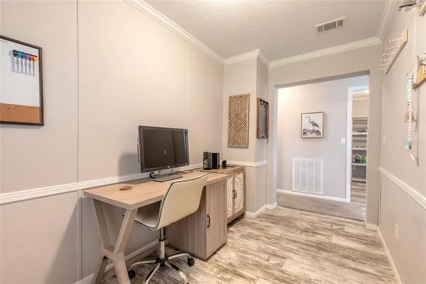 a workspace with furniture and wooden floor