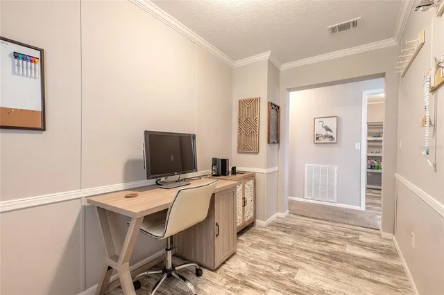 a workspace with furniture and wooden floor