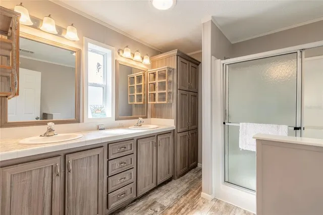 a bathroom with a double vanity sink mirror and double