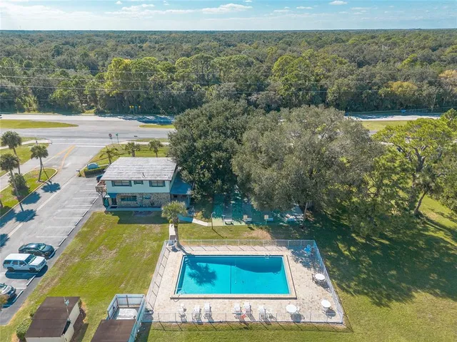 a view of a swimming pool with a yard