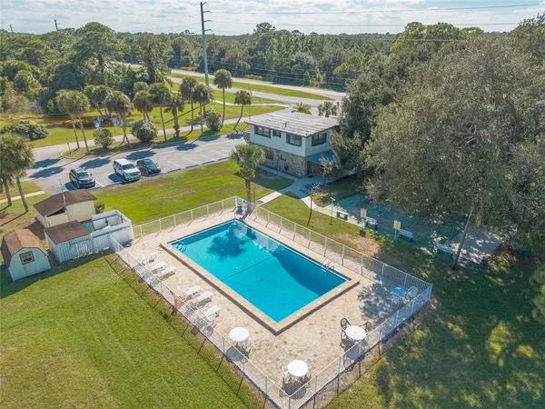 a view of a pool with a patio