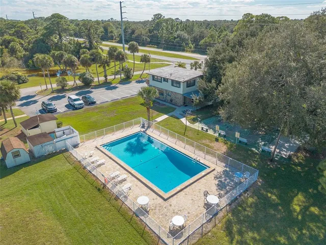 a view of a pool with a patio