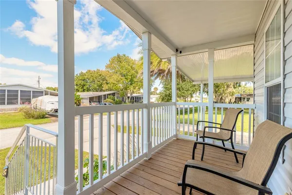 a view of a balcony with chairs