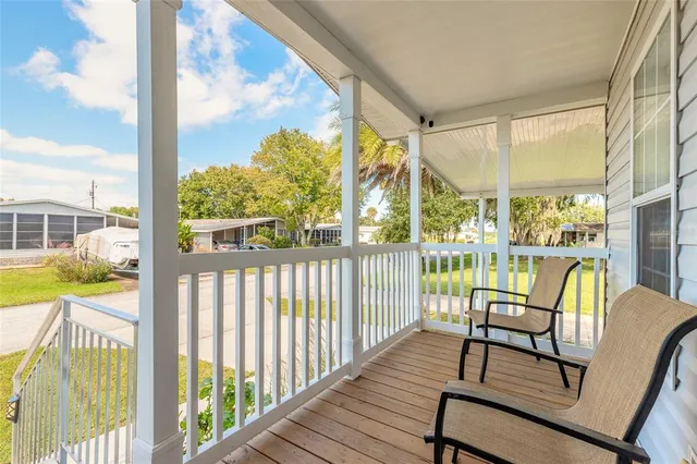 a view of a balcony with chairs
