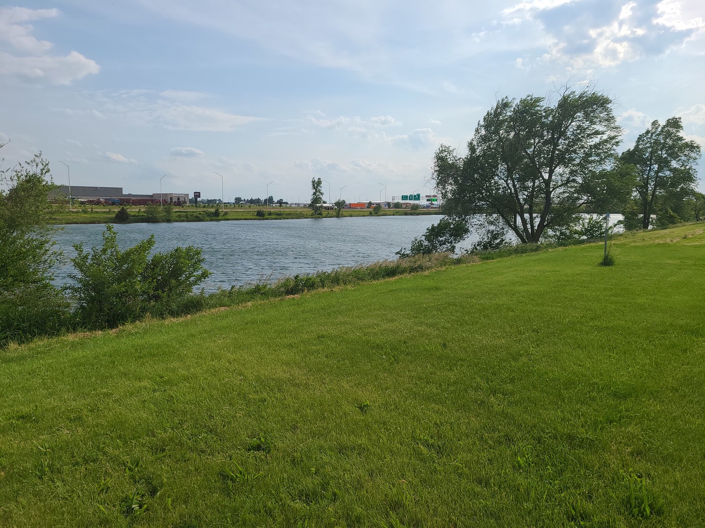 216 Lake Lida Lane Rochelle, IL 61068 - Photo 3 of 3 a view of a lake with houses in the back
