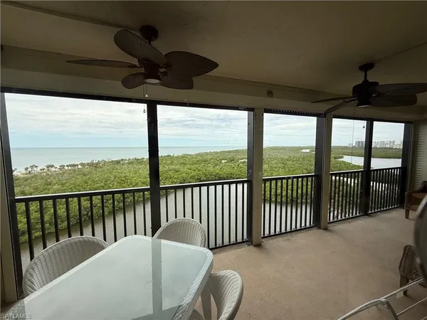 a view of a balcony with furniture