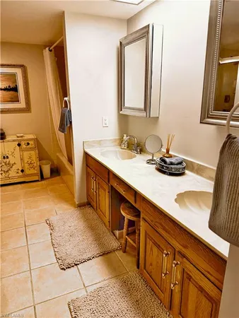 a bathroom with a sink a vanity and mirror