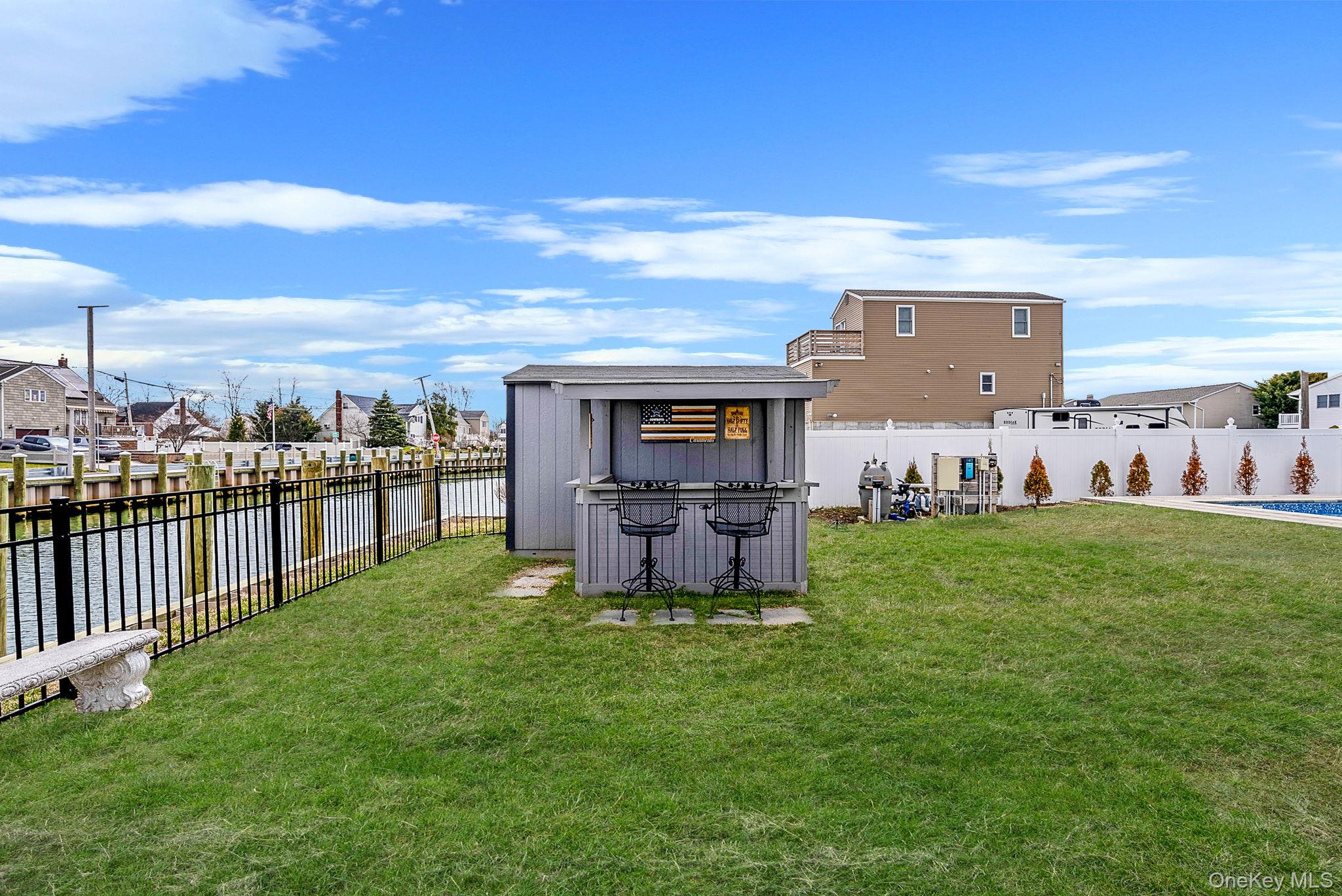 794 Pecan Street Lindenhurst, NY 11757 - Photo 14 of 44 a view of a house with a yard and sitting area