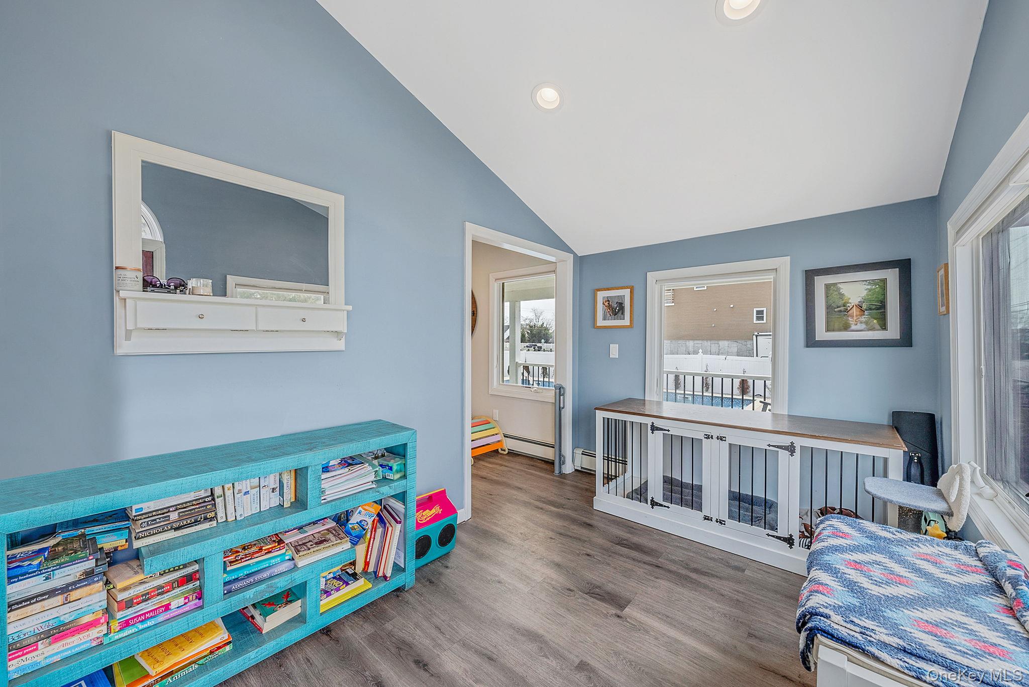 794 Pecan Street Lindenhurst, NY 11757 - Photo 15 of 44 a bedroom with furniture and a baby crib