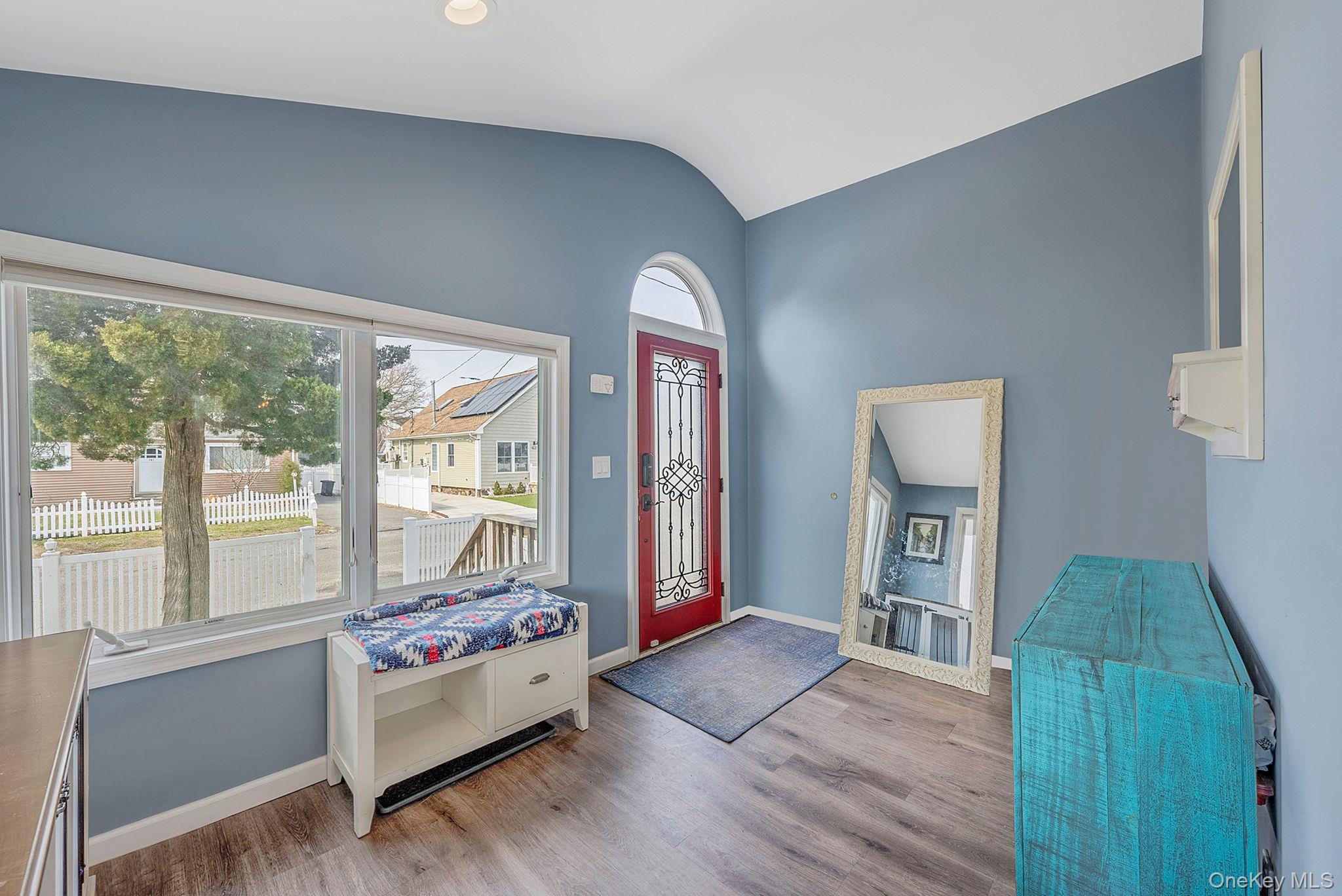 794 Pecan Street Lindenhurst, NY 11757 - Photo 16 of 44 a living room with furniture and a large window