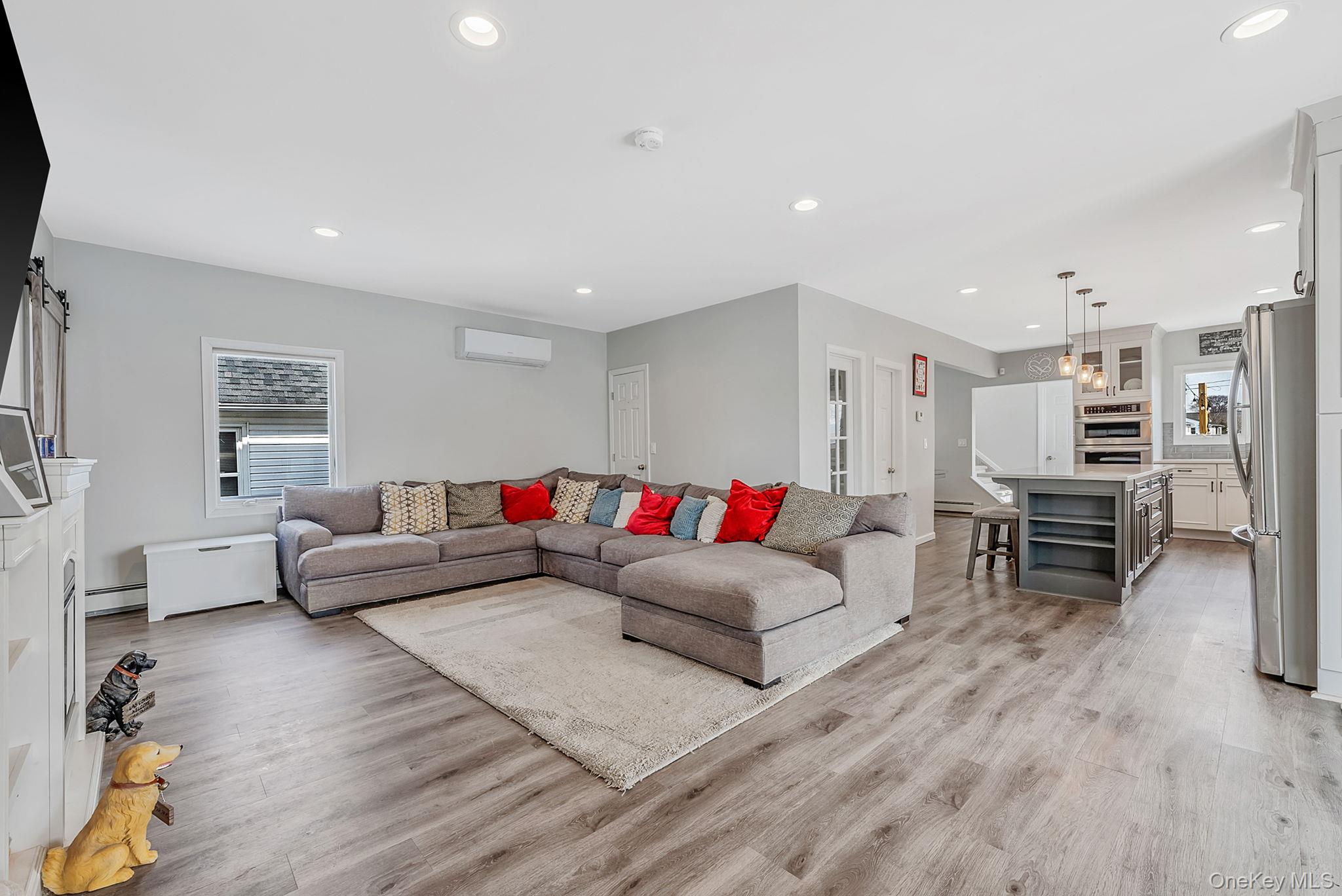794 Pecan Street Lindenhurst, NY 11757 - Photo 17 of 44 a living room with furniture and a wooden floor