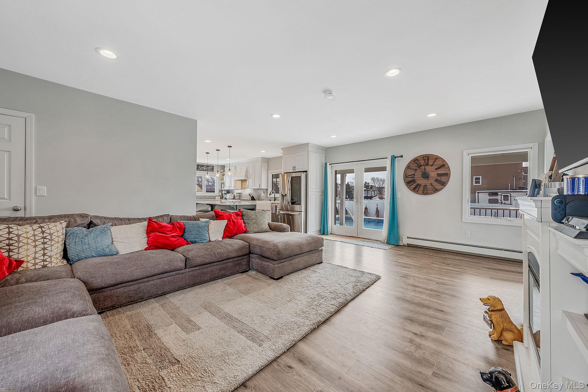 794 Pecan Street Lindenhurst, NY 11757 - Photo 18 of 44 a living room with furniture and kitchen view