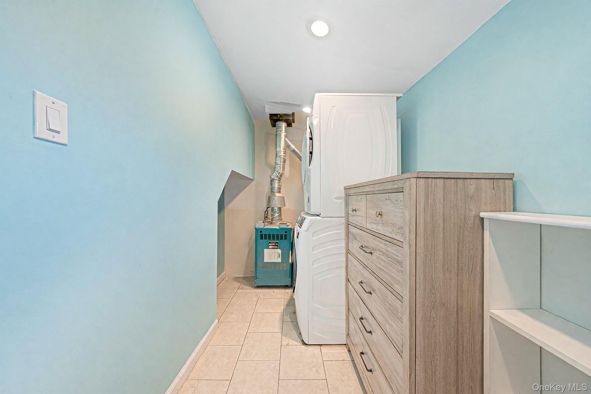 794 Pecan Street Lindenhurst, NY 11757 - Photo 41 of 44 a view of walk in closet with window