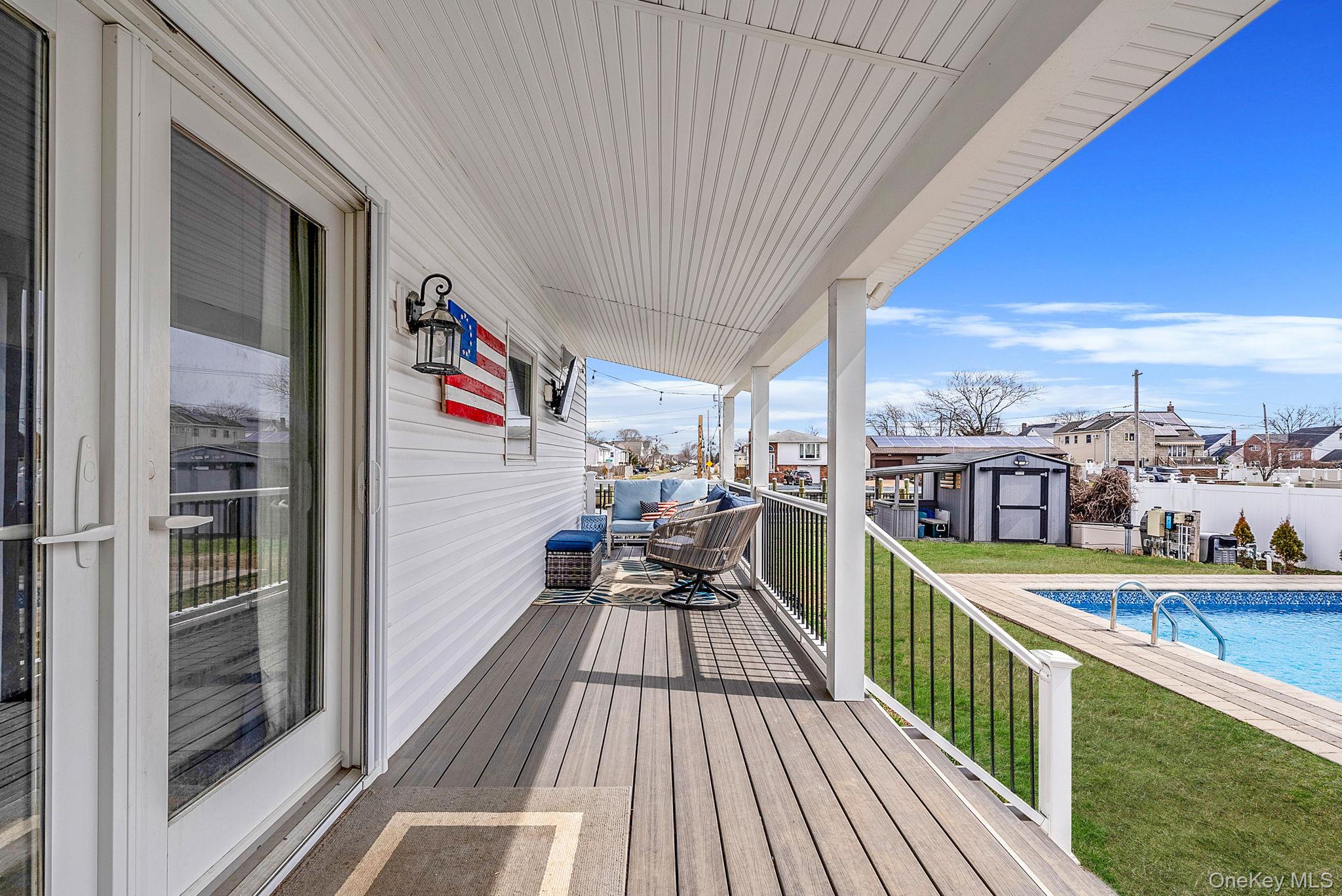 794 Pecan Street Lindenhurst, NY 11757 - Photo 6 of 44 a view of city from a balcony