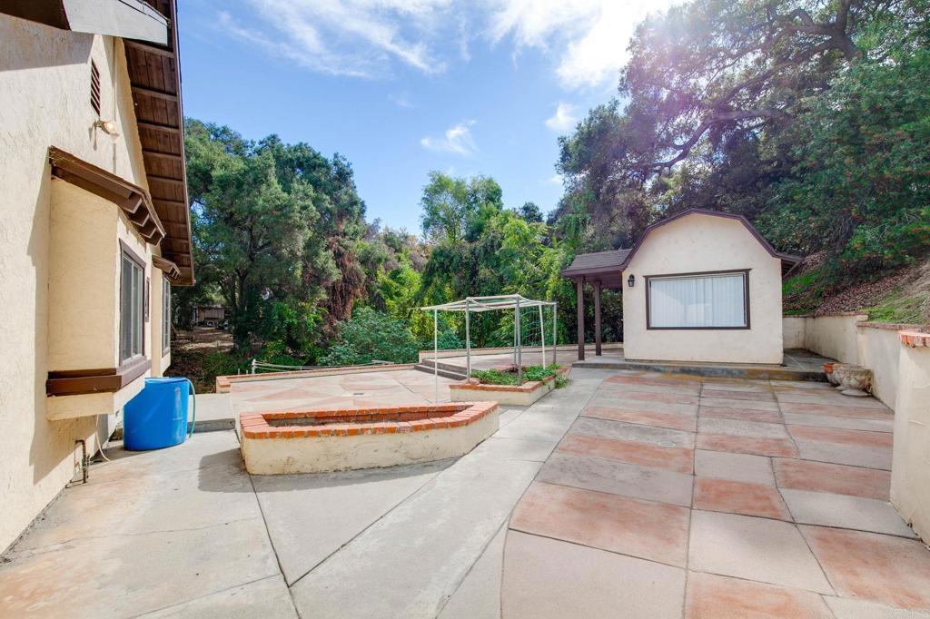 2573 Los Alisos South Fallbrook, CA 92028 - Photo 30 of 70 a wooden bench sitting in front of a house