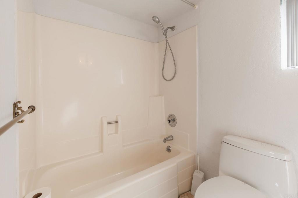 2573 Los Alisos South Fallbrook, CA 92028 - Photo 36 of 70 a bathroom with a shower and a toilet