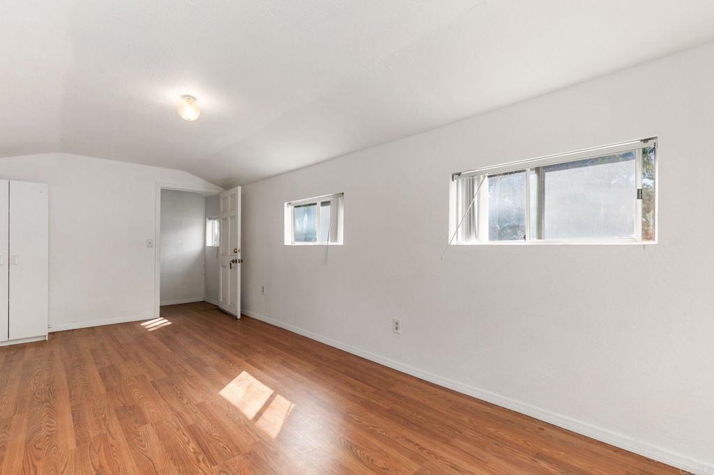 2573 Los Alisos South Fallbrook, CA 92028 - Photo 41 of 70 a view of an empty room with wooden floor and a window
