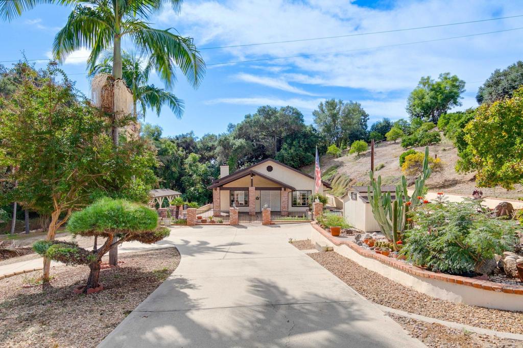 2573 Los Alisos South Fallbrook, CA 92028 - Photo 43 of 70 a swimming pool with outdoor seating and trees