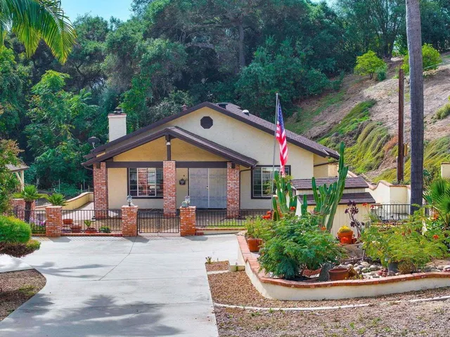 an aerial view of residential house with outdoor space