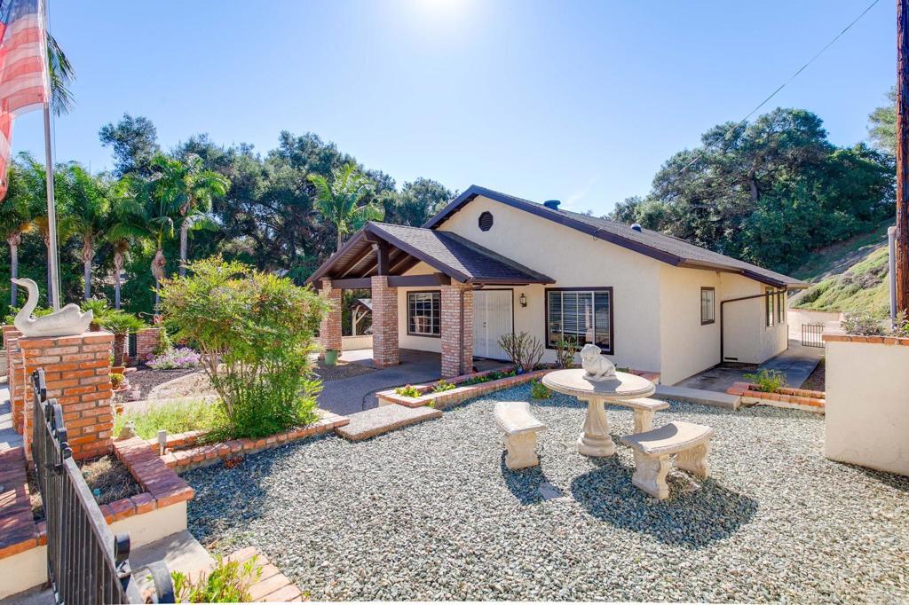 2573 Los Alisos South Fallbrook, CA 92028 - Photo 45 of 70 a front view of a house with a yard and outdoor seating