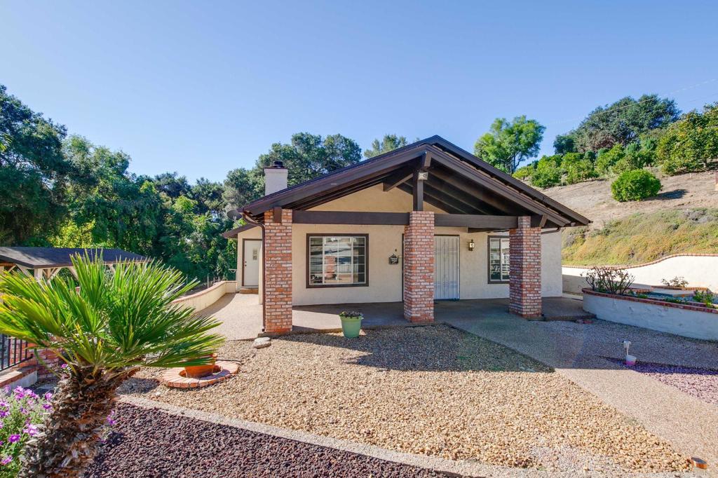 2573 Los Alisos South Fallbrook, CA 92028 - Photo 46 of 70 a view of a house with a yard and potted plants