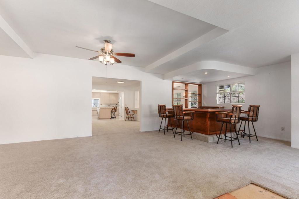 2573 Los Alisos South Fallbrook, CA 92028 - Photo 9 of 70 a view of a dining room with furniture and a chandelier fan