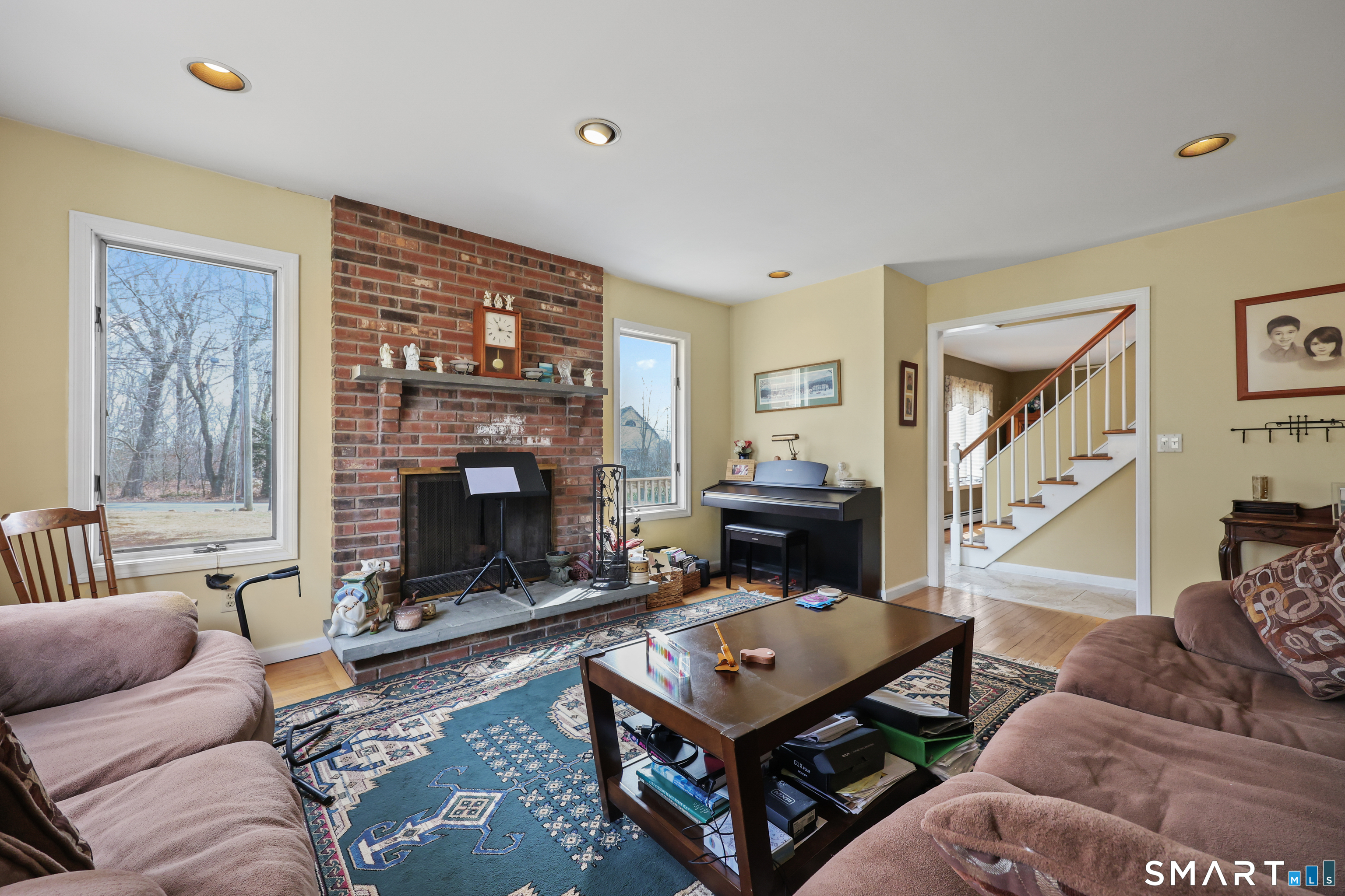 76 Shafer Road New Hartford, CT 06057 - Photo 12 of 25 Sun Filled Livingroom with classic fireplace & hardwood floor