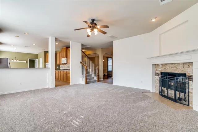 a view of an empty room with a fireplace