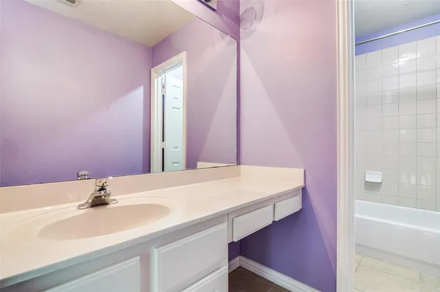 a bathroom with a sink and a bathtub