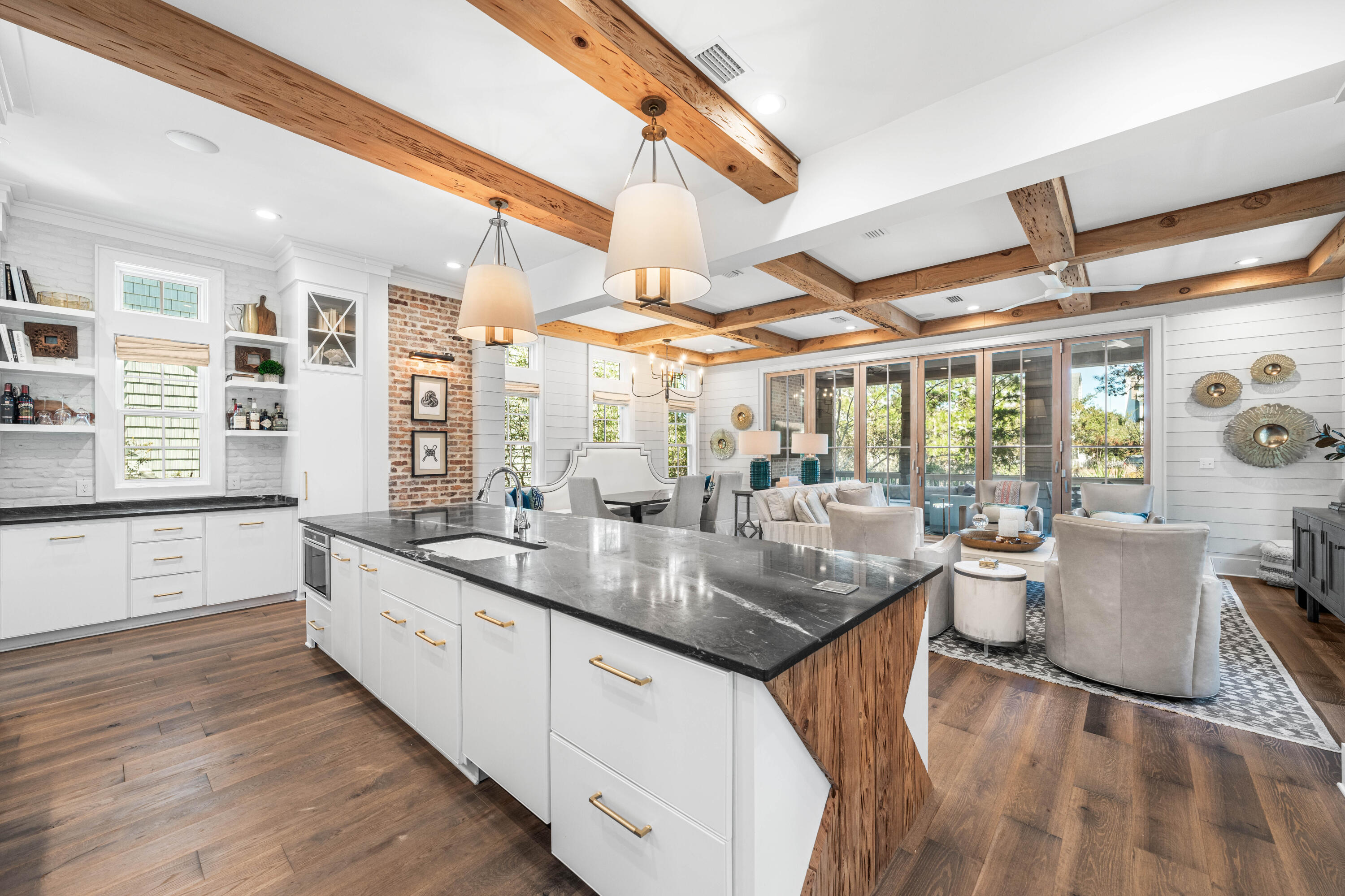 41 Compass Point Way Watersound, FL 32461 - Photo 13 of 75 a kitchen with stainless steel appliances granite countertop a sink and wooden cabinets with large window