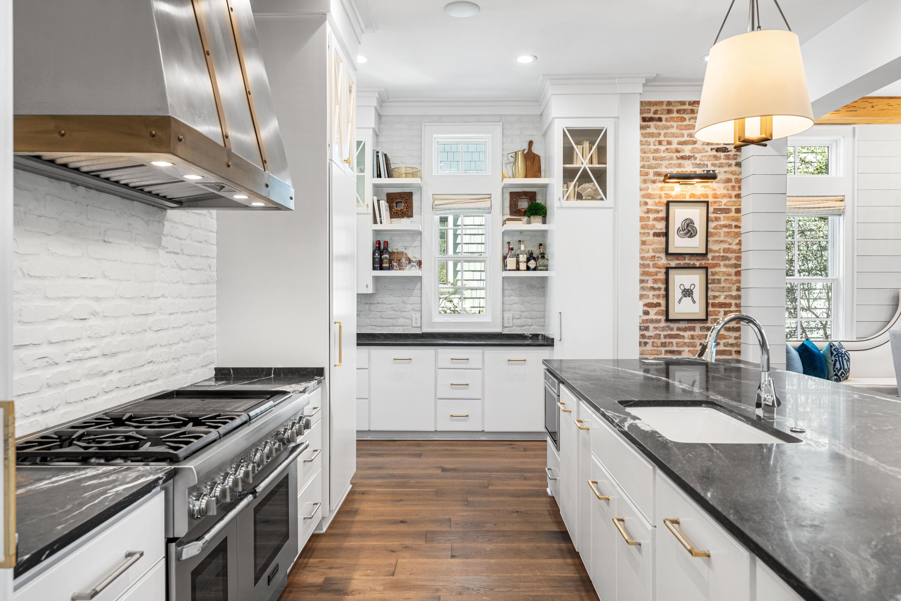 41 Compass Point Way Watersound, FL 32461 - Photo 14 of 75 a kitchen with stainless steel appliances granite countertop a stove a sink and a refrigerator