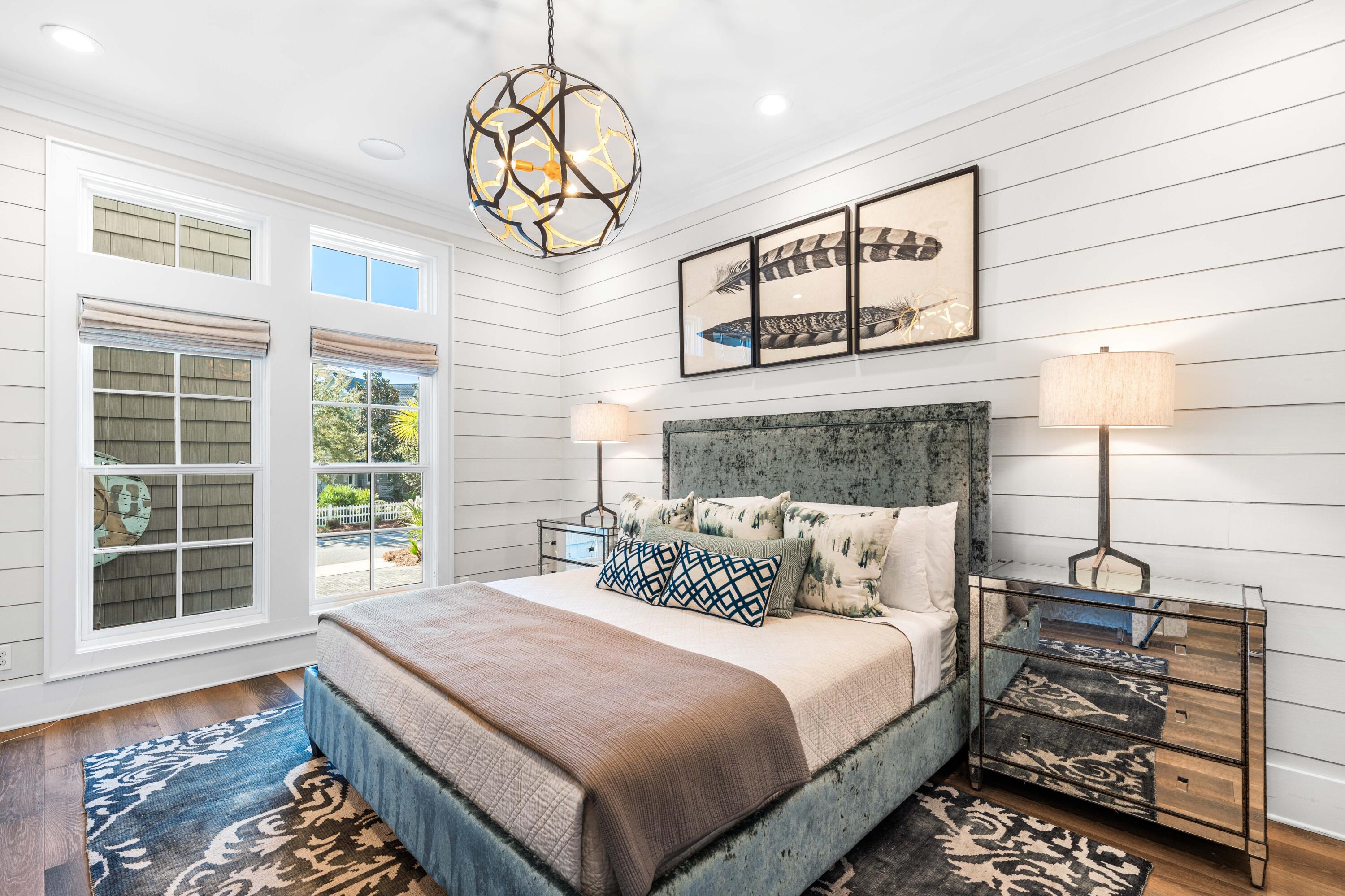 41 Compass Point Way Watersound, FL 32461 - Photo 19 of 66 a bedroom with a bed and a chandelier