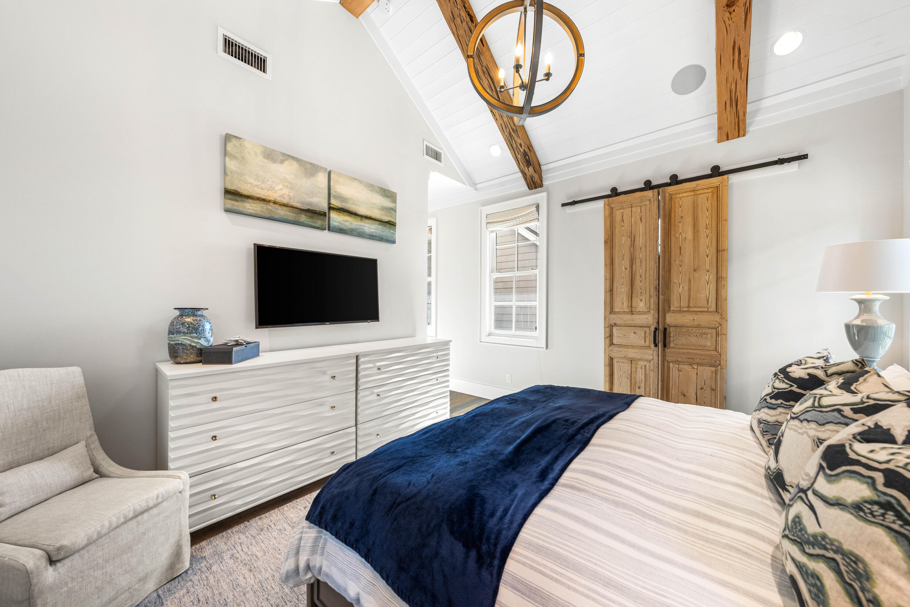 41 Compass Point Way Watersound, FL 32461 - Photo 30 of 66 a bedroom with a bed and a flat screen tv