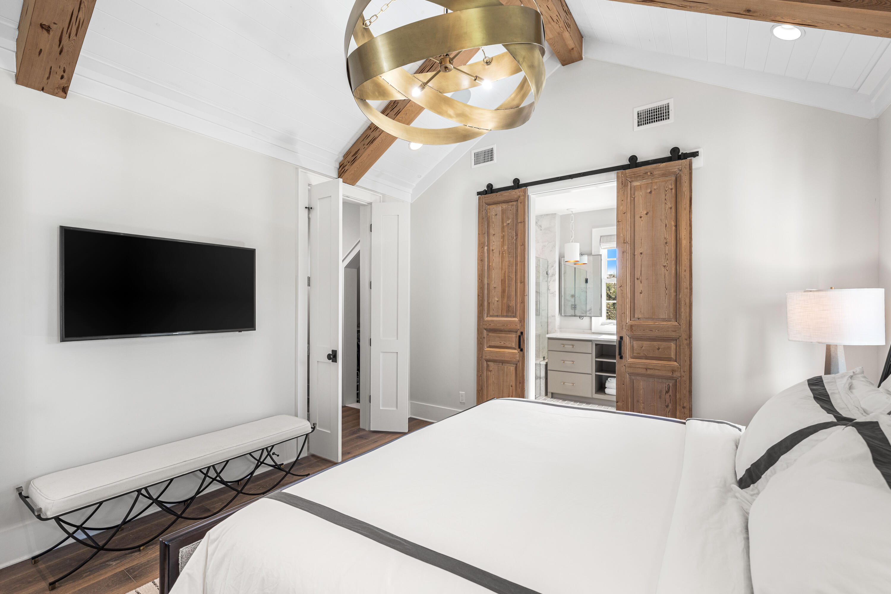 41 Compass Point Way Watersound, FL 32461 - Photo 37 of 75 a bedroom with a bed and a flat tv screen