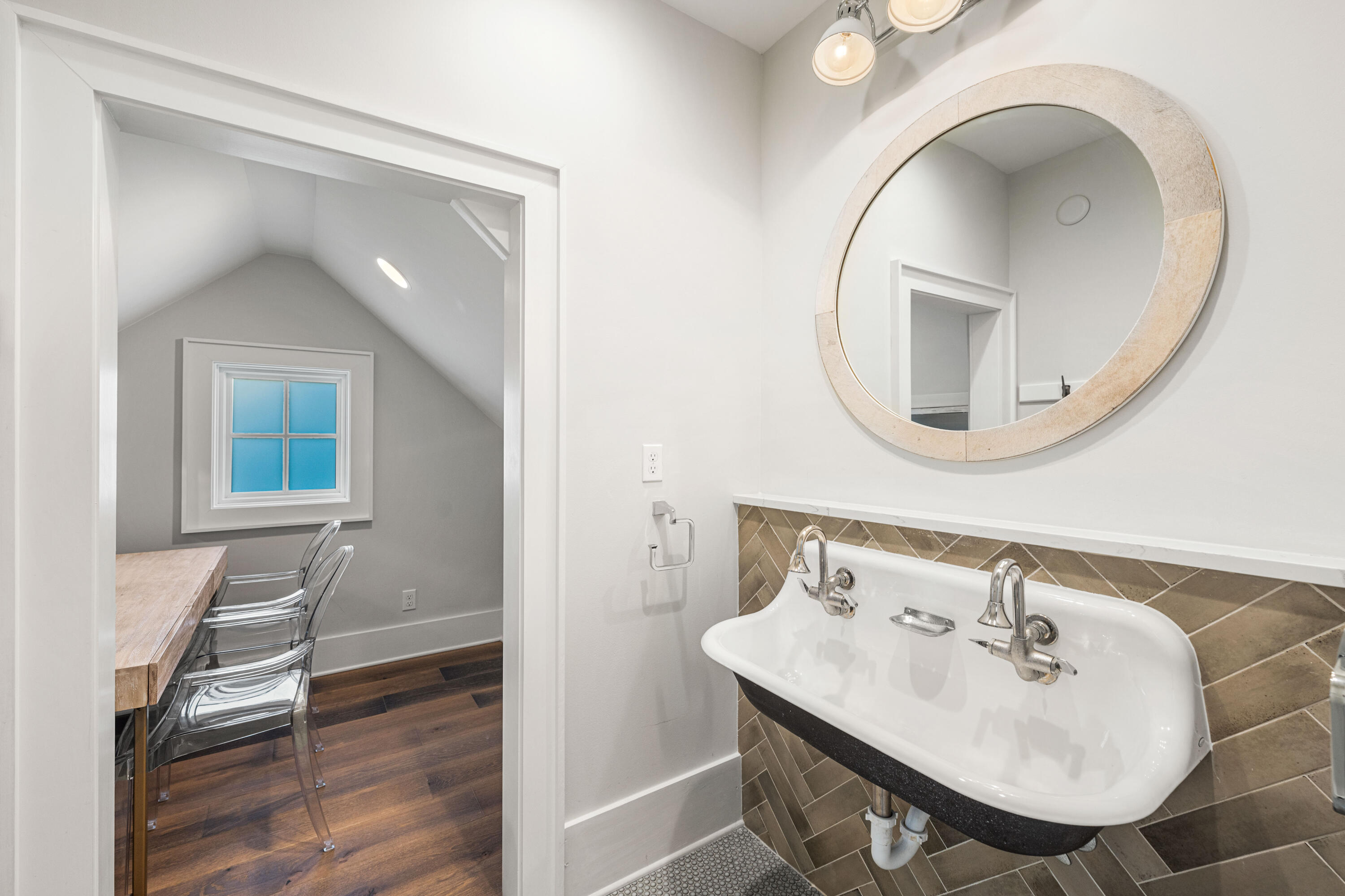 41 Compass Point Way Watersound, FL 32461 - Photo 54 of 75 a bathroom with a sink and a mirror