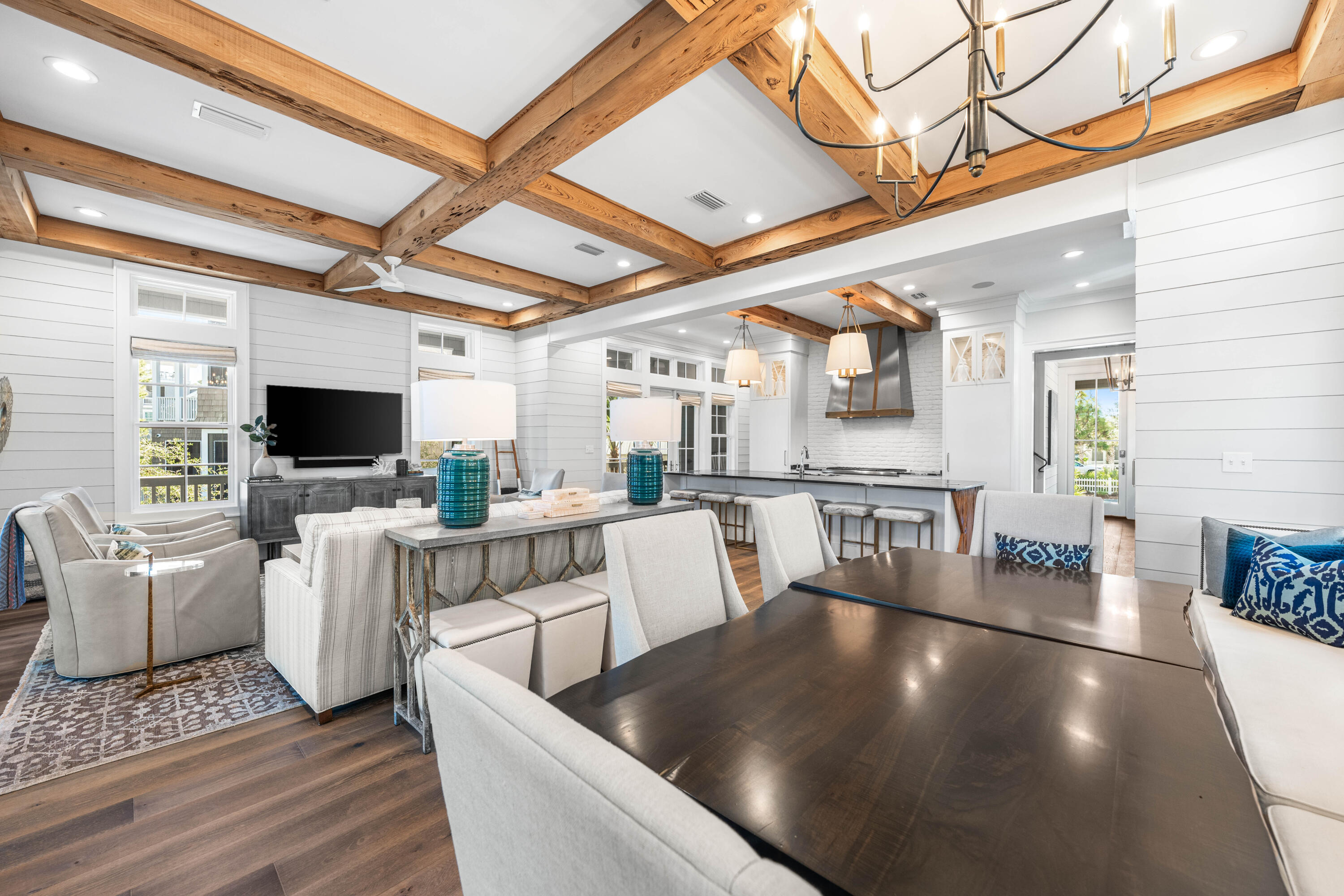 41 Compass Point Way Watersound, FL 32461 - Photo 9 of 75 a living room with couches a flat screen tv and a table