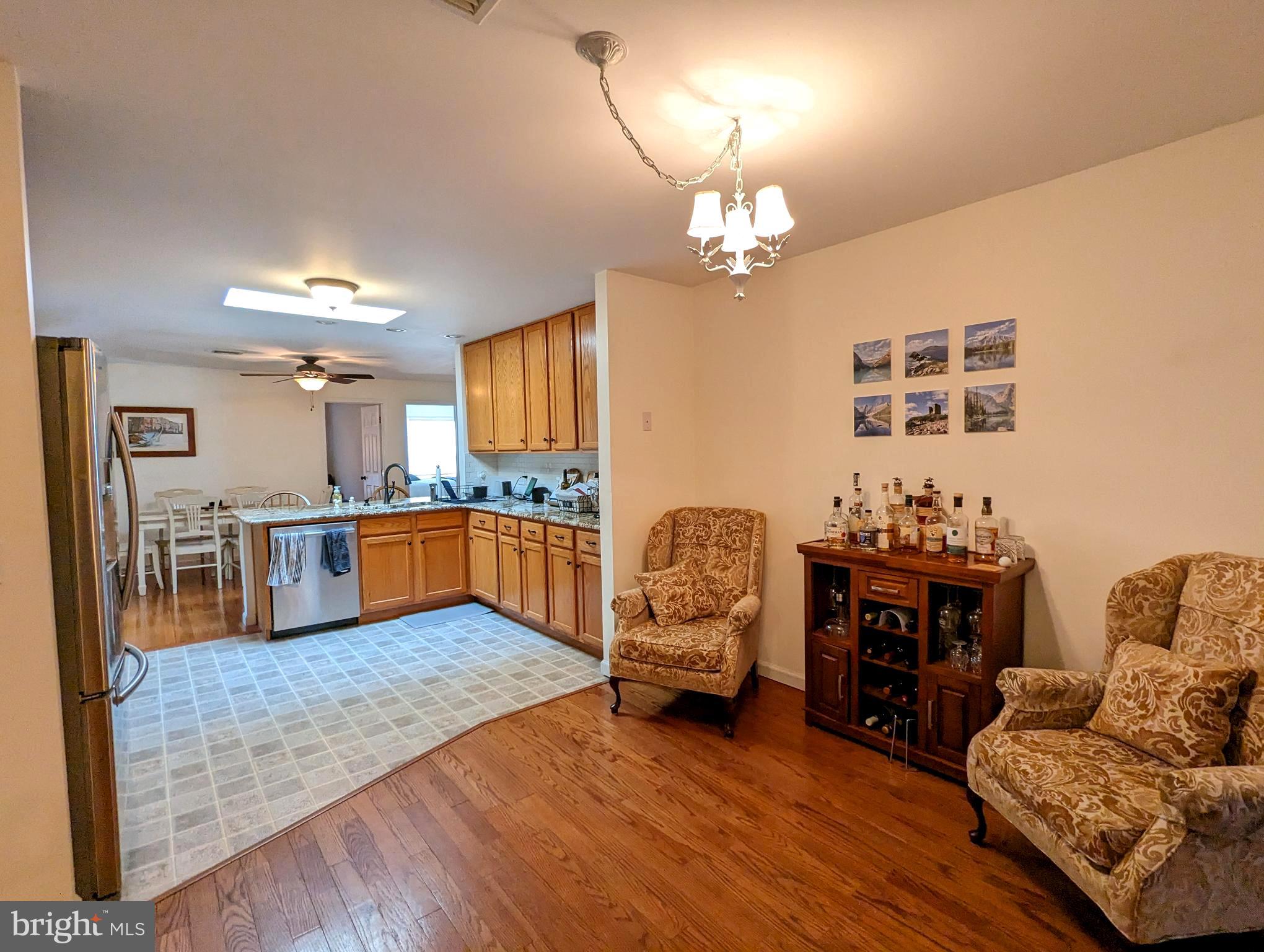 25 Maple Avenue Gettysburg, PA 17325 - Photo 15 of 35 a living room with furniture kitchen view and a chandelier
