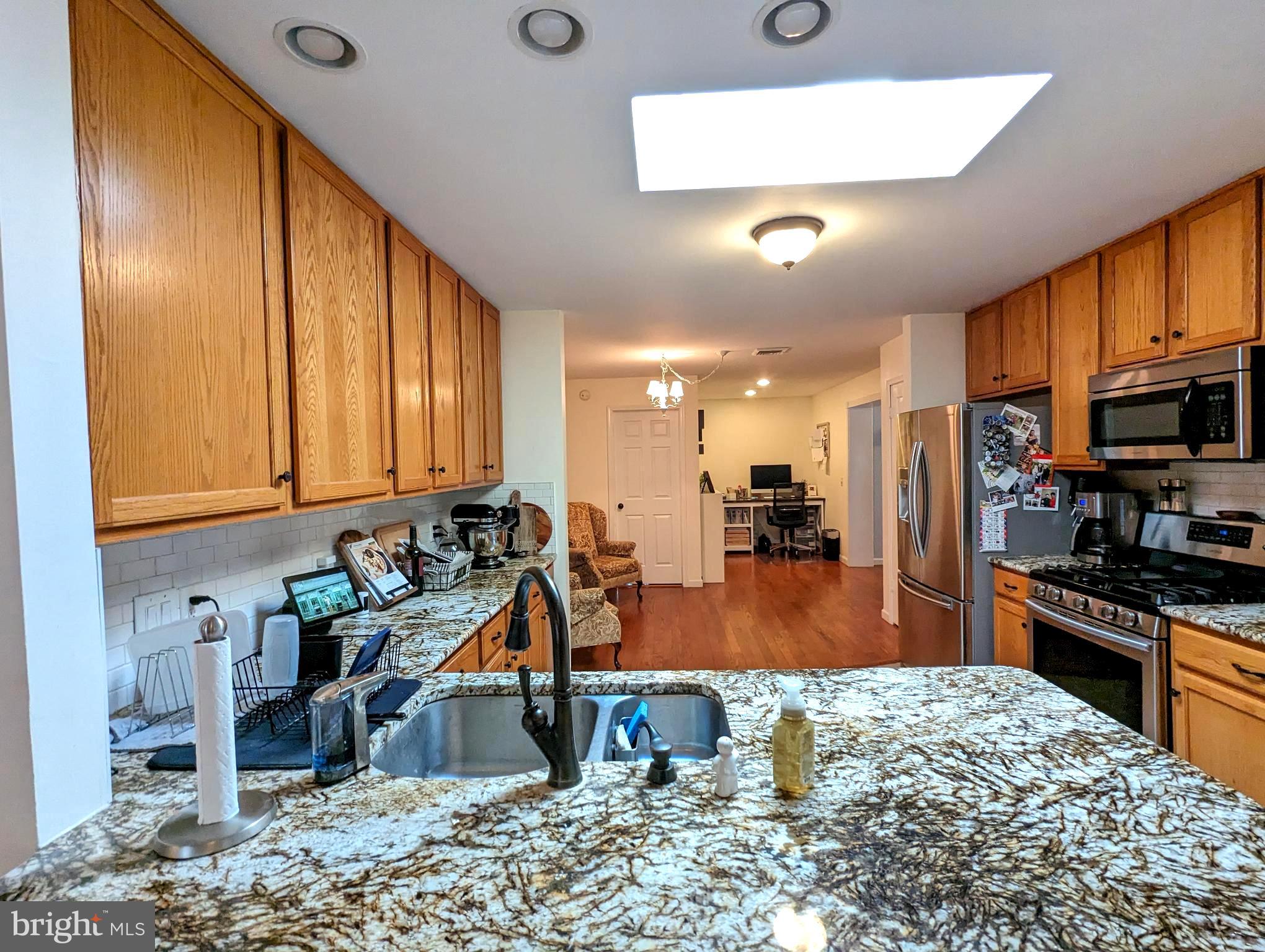 25 Maple Avenue Gettysburg, PA 17325 - Photo 19 of 35 a kitchen with stainless steel appliances granite countertop a refrigerator a stove and a sink with granite countertops