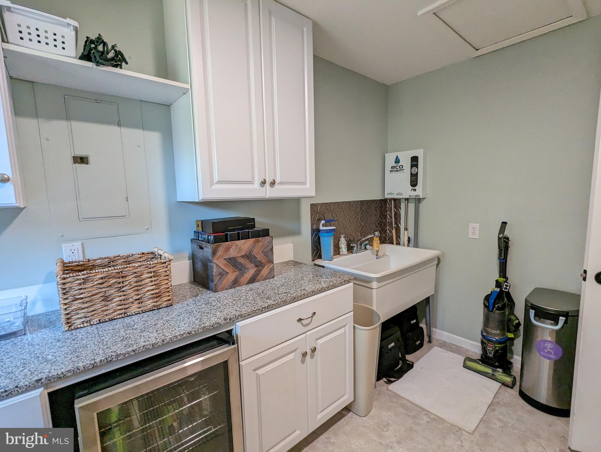 25 Maple Avenue Gettysburg, PA 17325 - Photo 29 of 35 a kitchen with granite countertop a sink a stove and cabinets