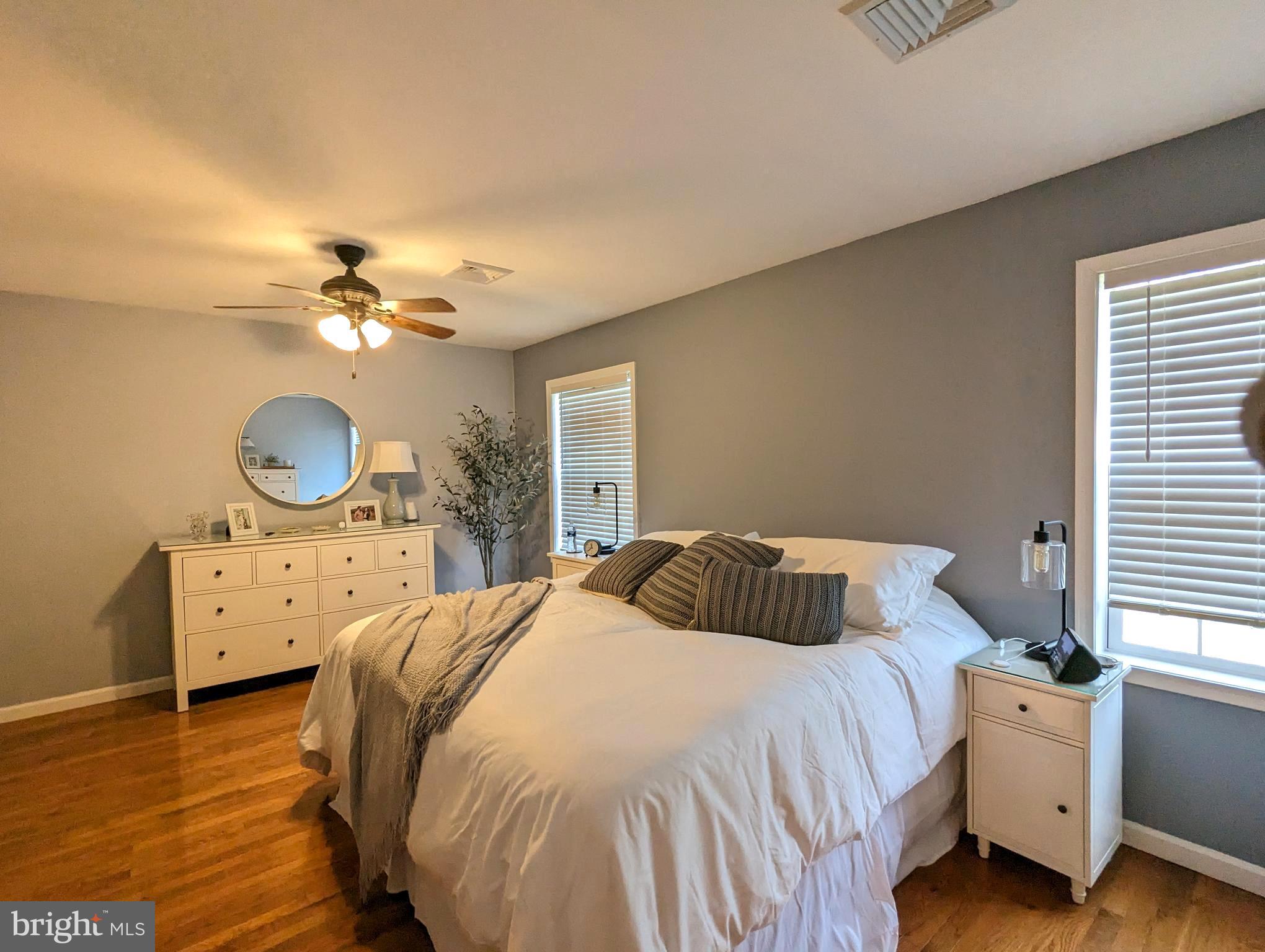 25 Maple Avenue Gettysburg, PA 17325 - Photo 30 of 35 a bedroom with a bed and a chandelier