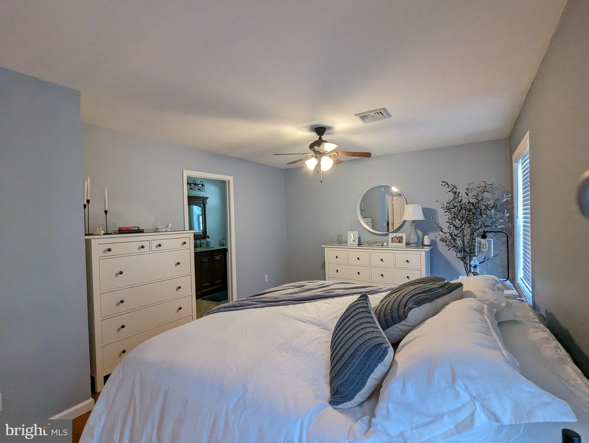 25 Maple Avenue Gettysburg, PA 17325 - Photo 31 of 35 a bedroom with a bed and chandelier